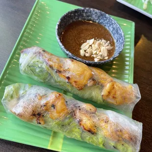 two rolls of food on a green plate