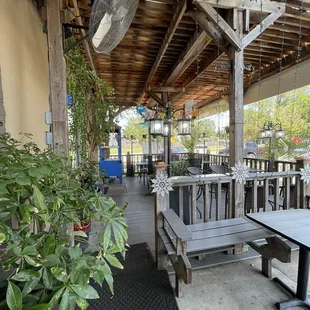 a patio with tables and benches