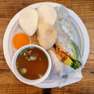 Banh Mi Dac Biet - House Special Vietnamese Sandwich ($12.50). Pork, fried egg, avocado; served w/ egg roll and a cup of beef broth.