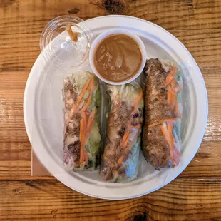 Fresh spring rolls with grilled beef. $10.95 for 3 rolls. Vermicelli, cucumber, bean sprouts, lettuce, purple cabbage, basil, peanut sauce.