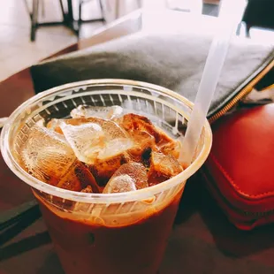 How my to-go iced milk coffee arrived. Too much ice, not enough coffee!