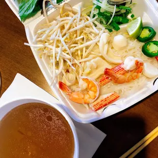 Seafood pho, to-go.