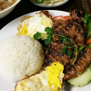 steamed rice with grilled pork chops together with 2 fried eggs!