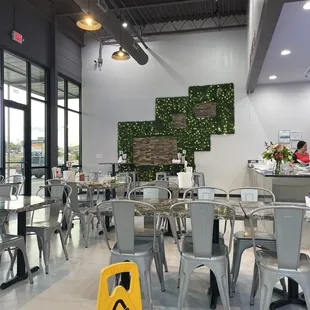 a yellow caution sign in a restaurant