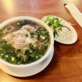 a bowl of soup and a spoon on a table