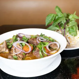 a bowl of beef and vegetable soup