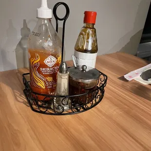 a table with condiments and condiments