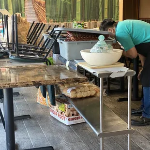 a woman preparing food in a restaurant