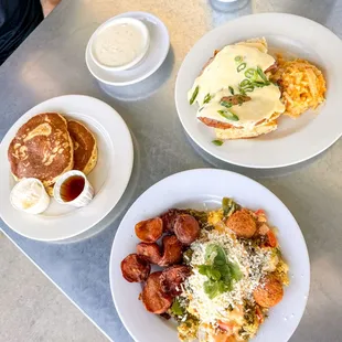 Buttermilk flapjack short stack, goat cheese grits (a la carte), migas with chorizo, Phoebe&apos;s benedict