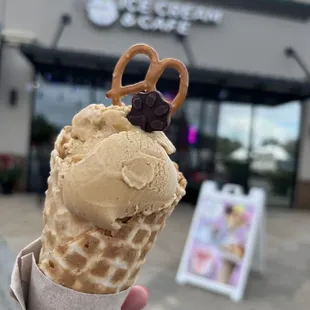 Single scoop bananas foster in a waffle cone