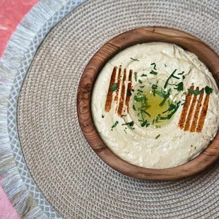Enjoy our house-made garbanzo bean dip, enriched with garlic, lemon juice, and tahini, served with warm, fluffy pita bread.