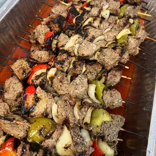 Tender beef skewers with grilled veggies, bursting with Mediterranean spices. Perfect for any feast!