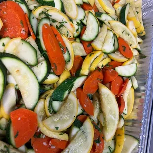 Fresh sautéed zucchini, squash, and peppers in olive oil and garlic. A colorful veggie delight!