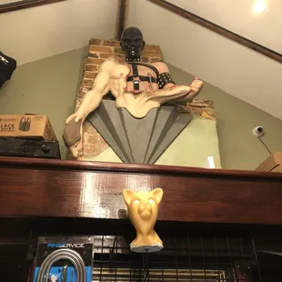 a statue of a naked man on a table