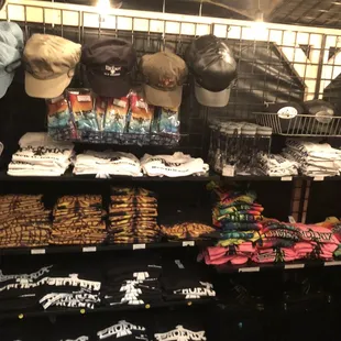 a variety of hats and t - shirts
