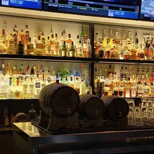 shelves of liquor bottles and glasses