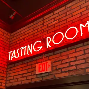 the neon sign for the tasting room