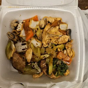 chicken and vegetables in a styrofoam container