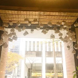 Window installation of hanging coffee mugs