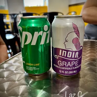 two cans of soda on a table