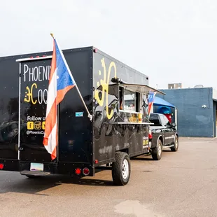 a truck with a flag on the back