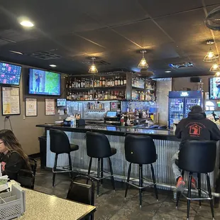 people sitting at the bar