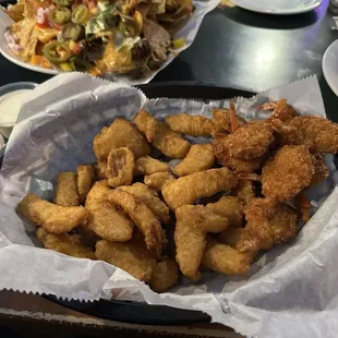 Full size nachos, butterfly shrimp (12 in the order) and onion petals