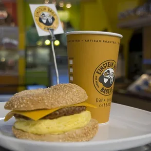 a breakfast sandwich and a cup of coffee
