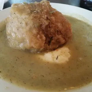 Chicken ball - pulled roasted chicken mixed with stuffing and fried on top of mashed potatoes and gravy
