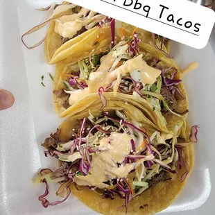 Korean b q beef tacos made with my signature bbq sauce and cream sauce  topped with sesame seeds