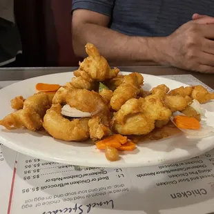 a plate of fried food on a table