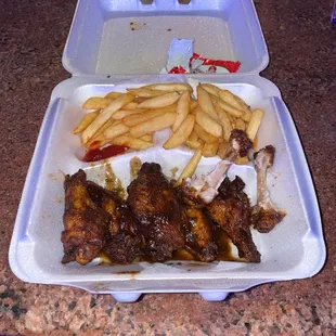 Jerk chicken wings and fries