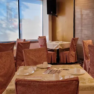 a dining room with a view of the city