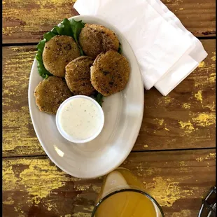 a plate of food and a glass of beer