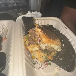 a sandwich in a styrofoam container