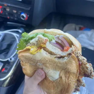 Turkey burger with cheese and everything on it