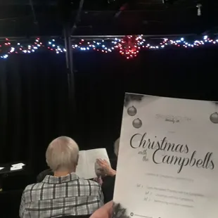 Waiting for play to start. Sitting in row 3, off center of stage right.