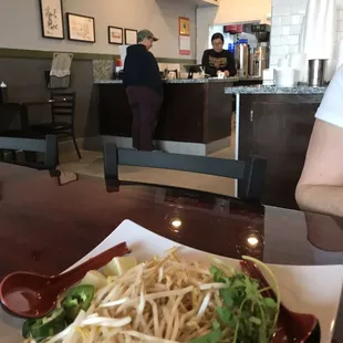 View from table to counter and fixins for the soup.