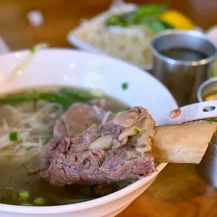 a bowl of beef and noodles