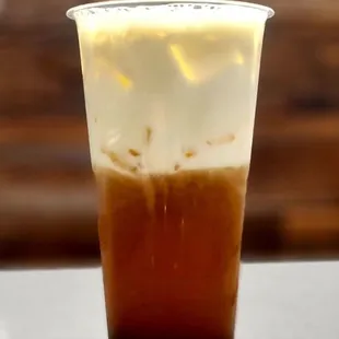a cold beverage in a plastic cup