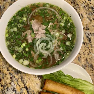 #15 Pho Noodle Soup with Sliced Rare Tender Beef. Egg Rolls