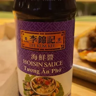 a bottle of hot sauce on a table