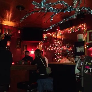 a group of people sitting at a bar