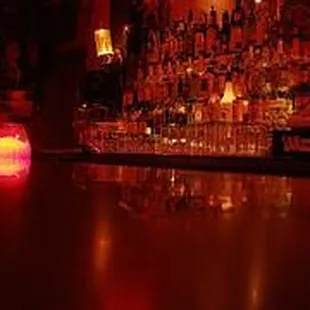 a bar with candles and bottles