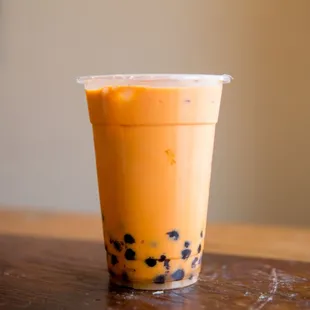 a plastic cup of bubble tea