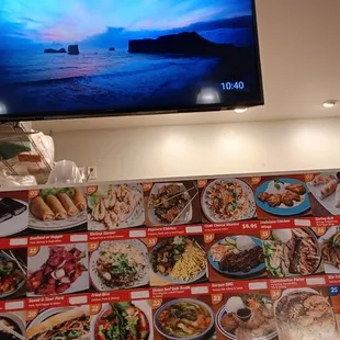 a restaurant with menus and a flat screen tv