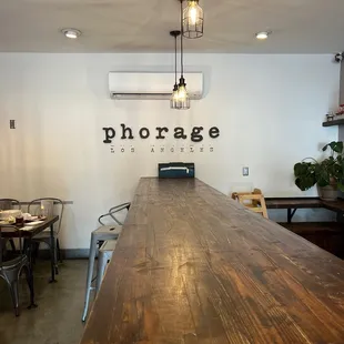 a long wooden table in a restaurant