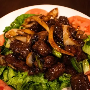 a plate of meat and vegetables