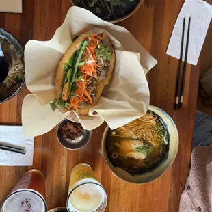 Grilled fish pho ( we shared between two people), a packed beef banh mi with beef broth on the side to dip it in, and a couple beers.