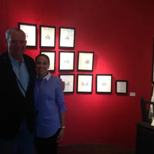 Happy customer and Louis in front of the" Shared Vision" collection she purchased.